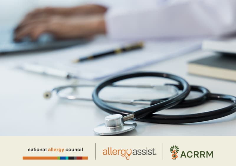 A stethoscope on a desk with a person typing on a laptop in the background. Logos for National Allergy Council, Allergy Assist, and ACRRM are visible.