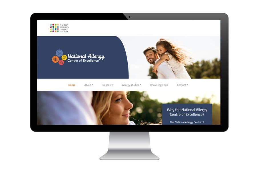 Computer screen displaying the National Allergy Centre of Excellence website, featuring a smiling couple outdoors and navigation menu.